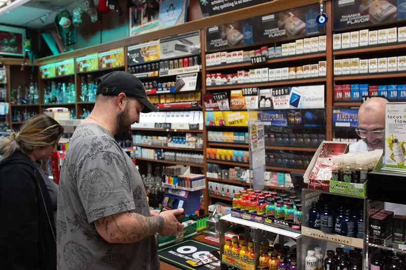 The cigarette wall behind the counter at La Brea Cigar & Cigarettes