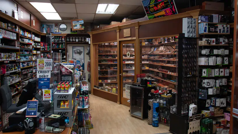 Inside the shop, looking past the counter toward the humidor